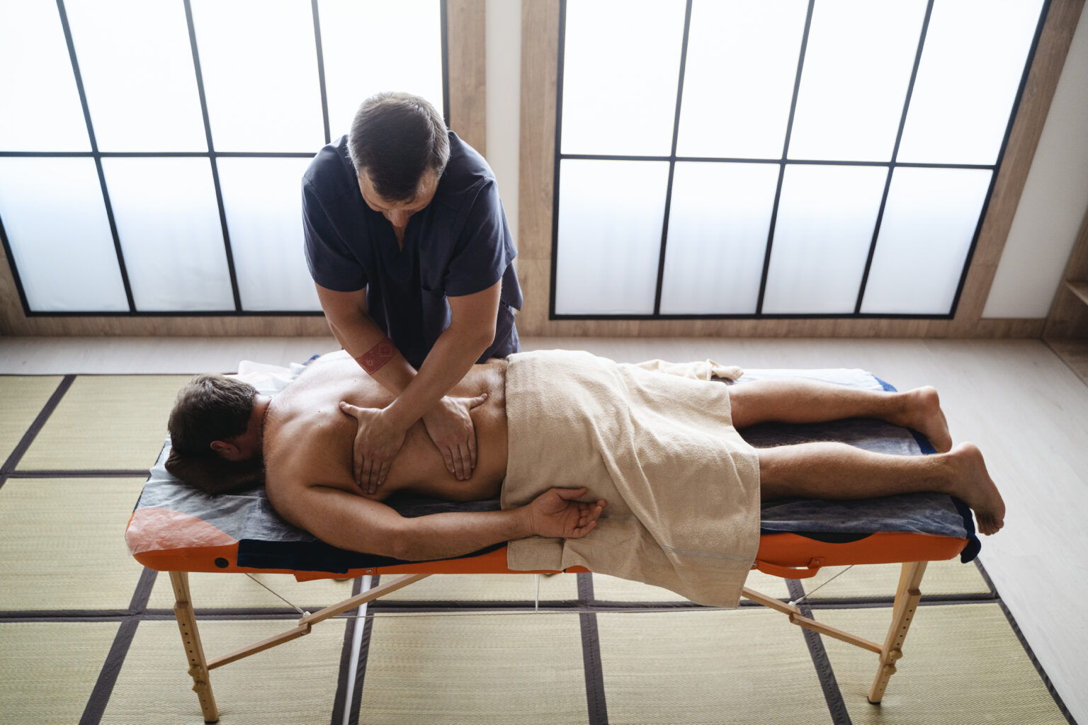 high-angle-man-getting-massage